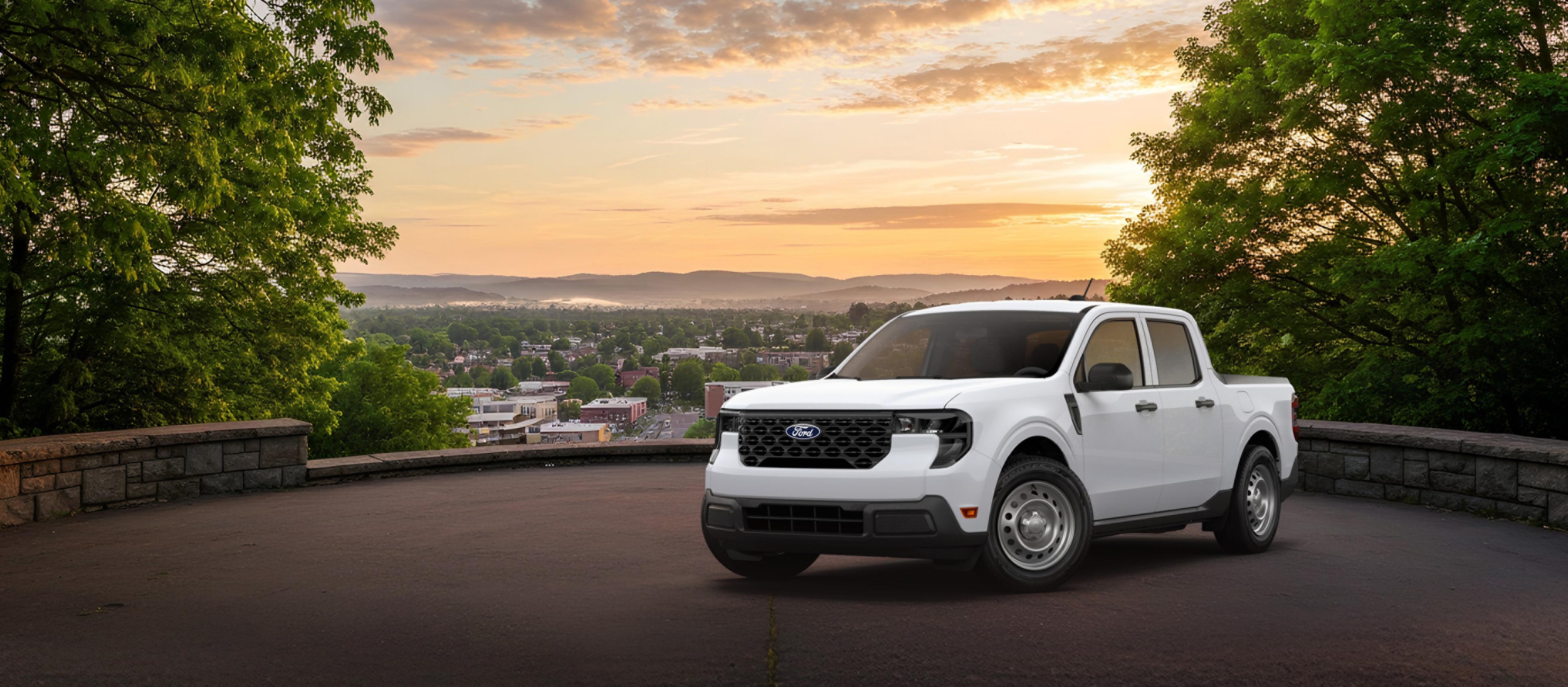 2026 Ford Maverick® pickup in Oxford White parked overlooking a city