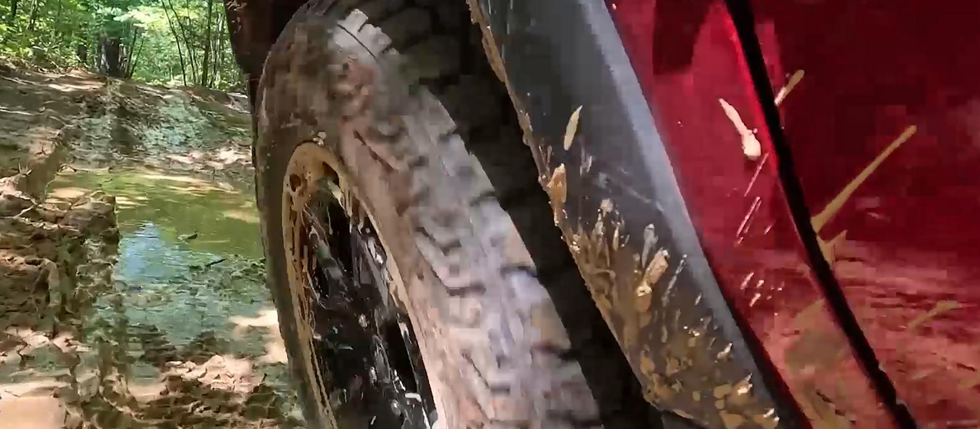 A Ford 2026 Bronco Sport® being driven through a forest