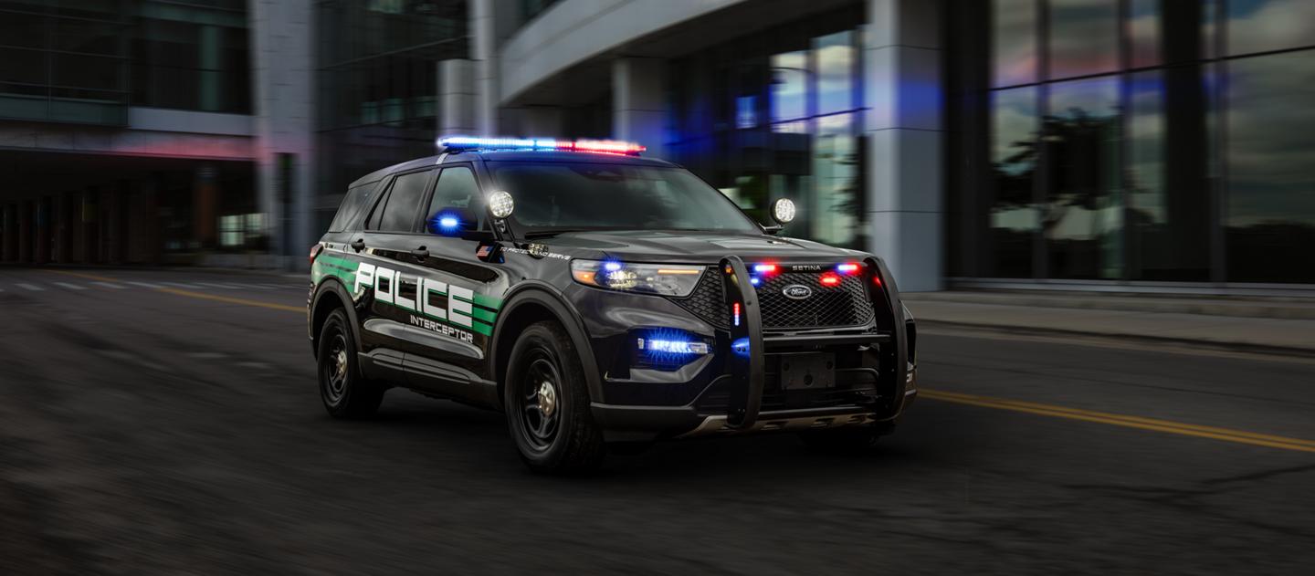 A 2025 Ford Police Interceptor® Utility being driven in an urban environment