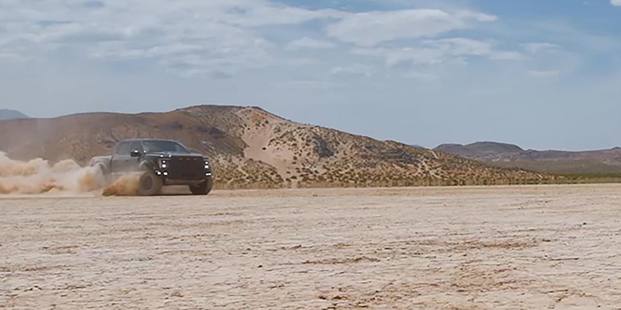 A Ford F-150® Raptor® R™ driving through the desert