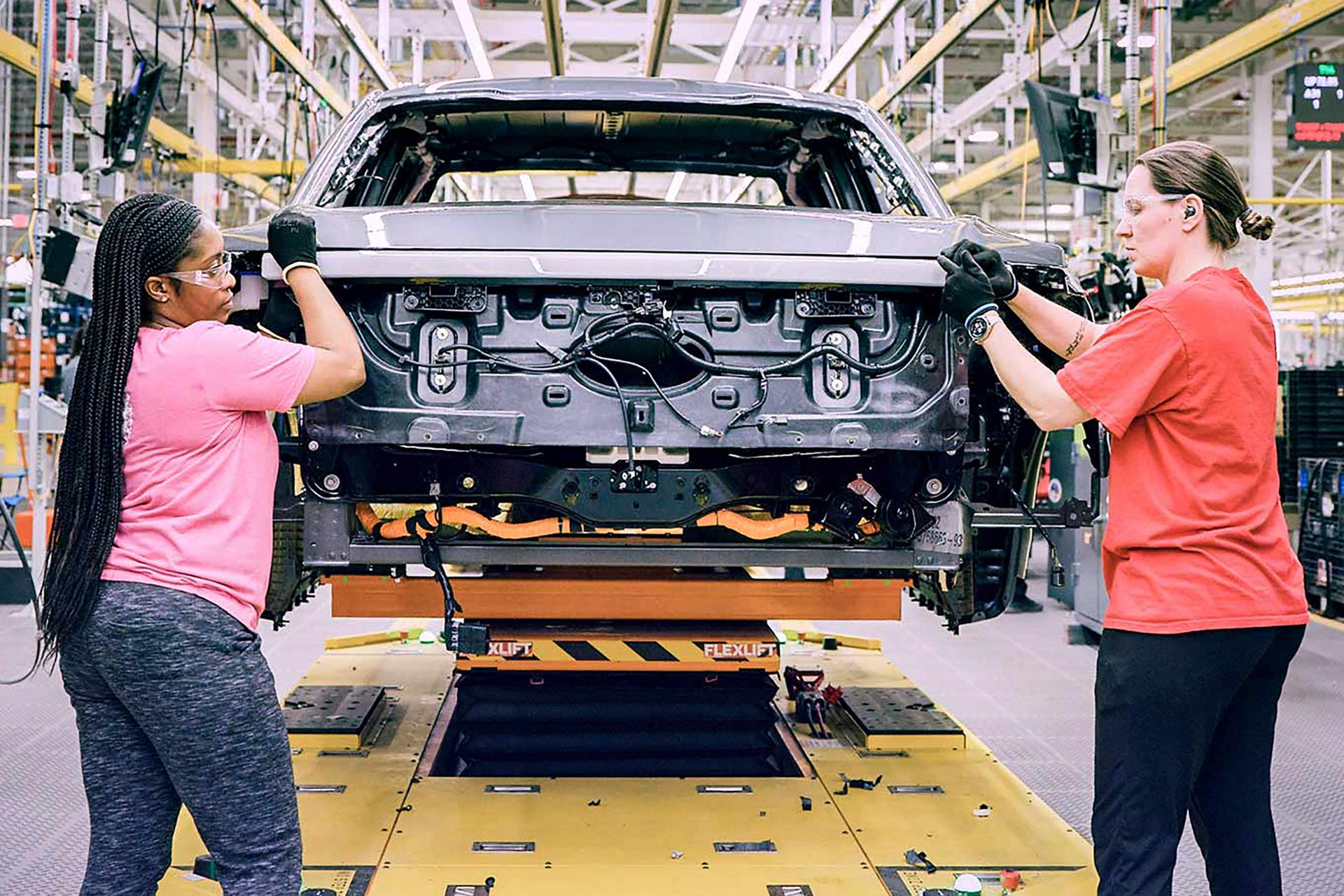 Women employees working on plant line 1942