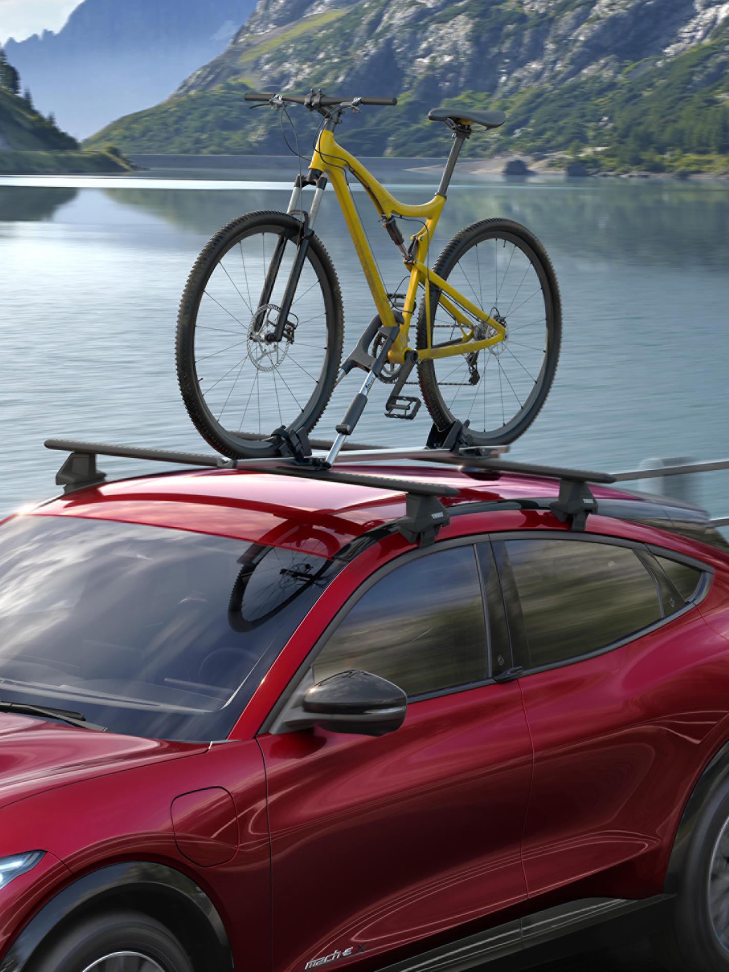 Ford Mustang Mach-E® traveling with a bike clamped on the roof
