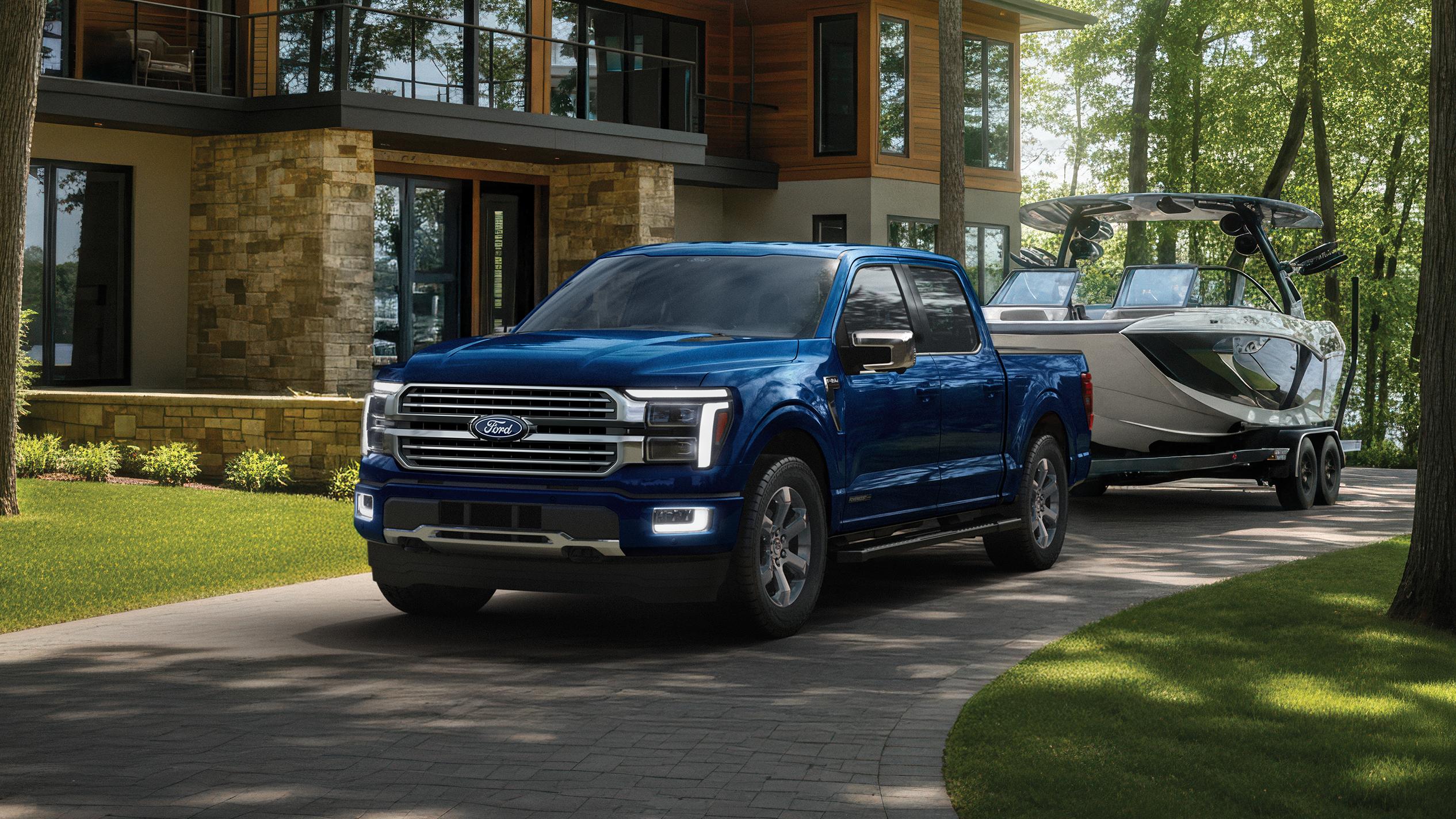 2027 Ford F-150® Platinum® model with the Satin Package pulling a small trailer