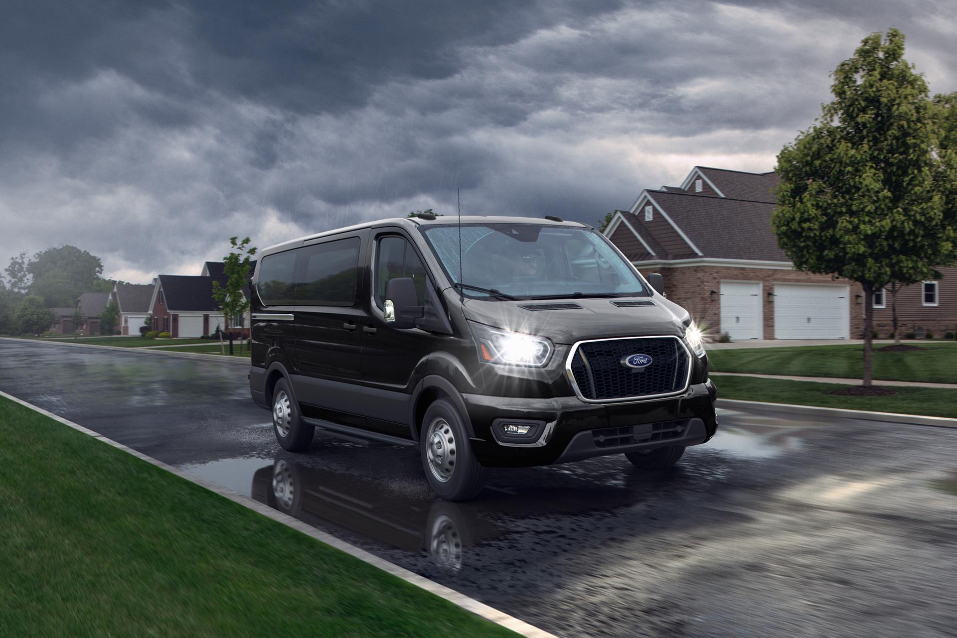 A 2026 Ford Transit® Van driving in a neighborhood