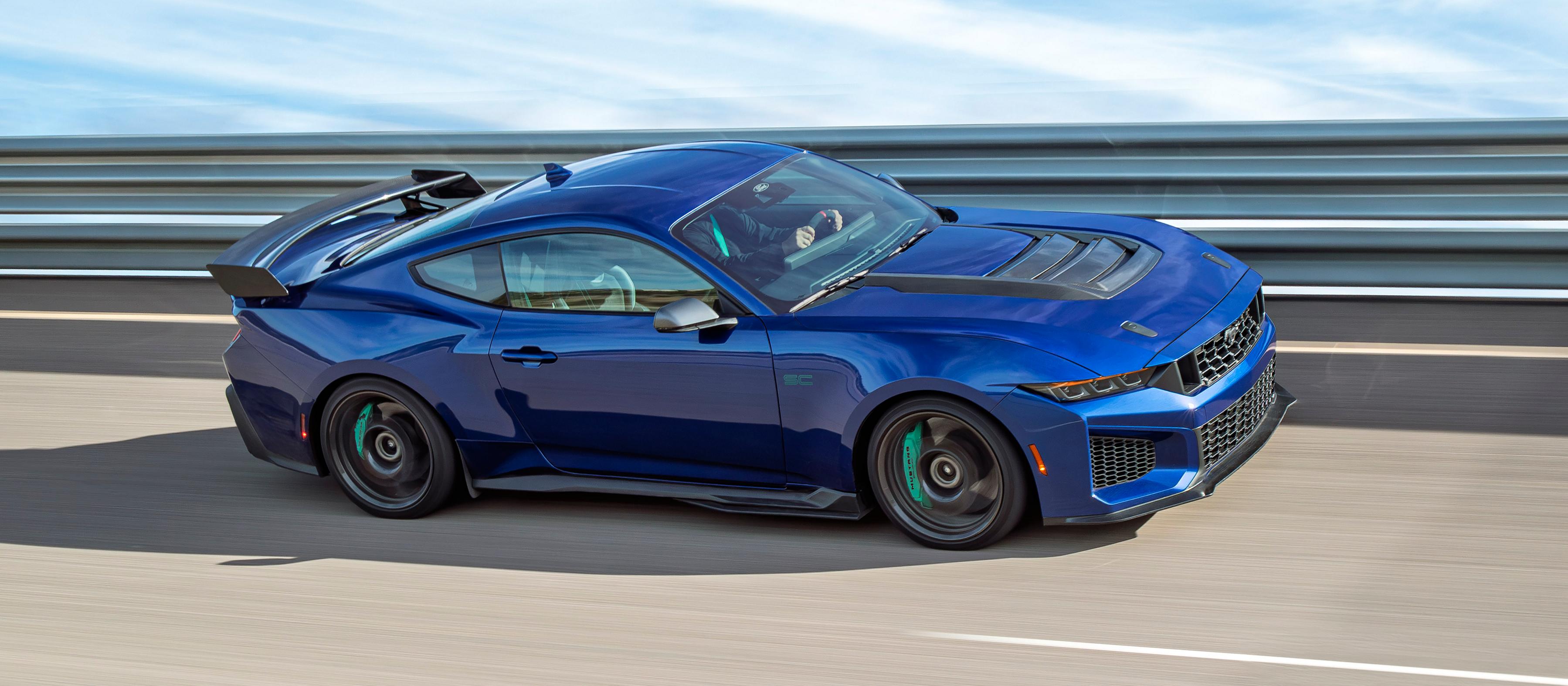 A 2026 Ford Mustang Dark Horse® SC with Track Pack and optional equipment driving on a closed track