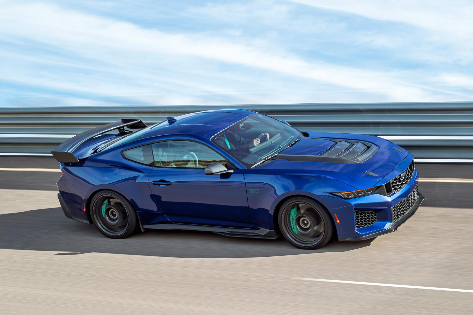 A 2026 Ford Mustang Dark Horse® SC with Track Pack and optional equipment driving on a closed track