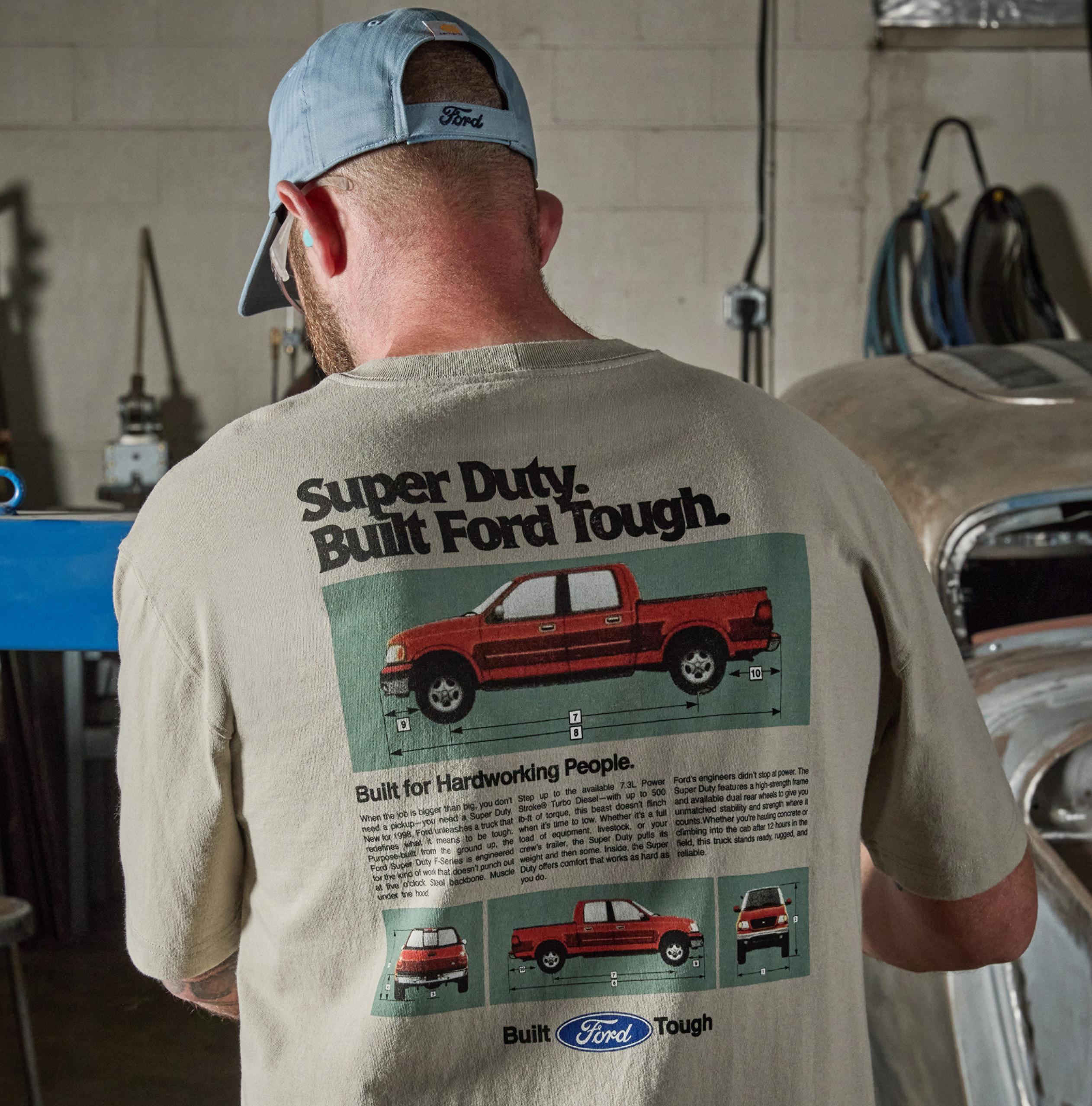 Person standing with their back showing while wearing the Carhartt® and Ford branded T-shirt