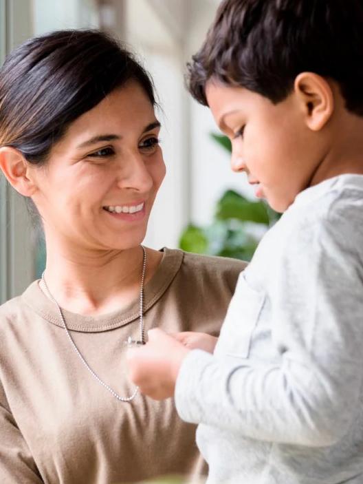 Woman smiling at a boy