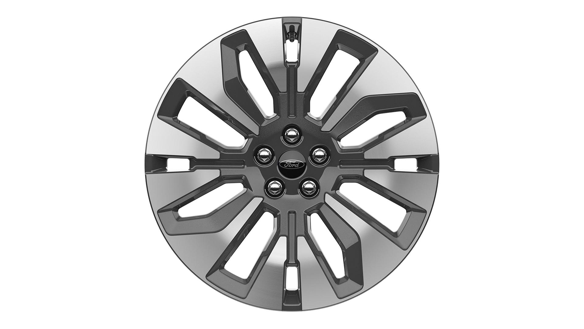 A 21-inch bright machined aluminum wheel with Tarnish Dark pockets on a white background