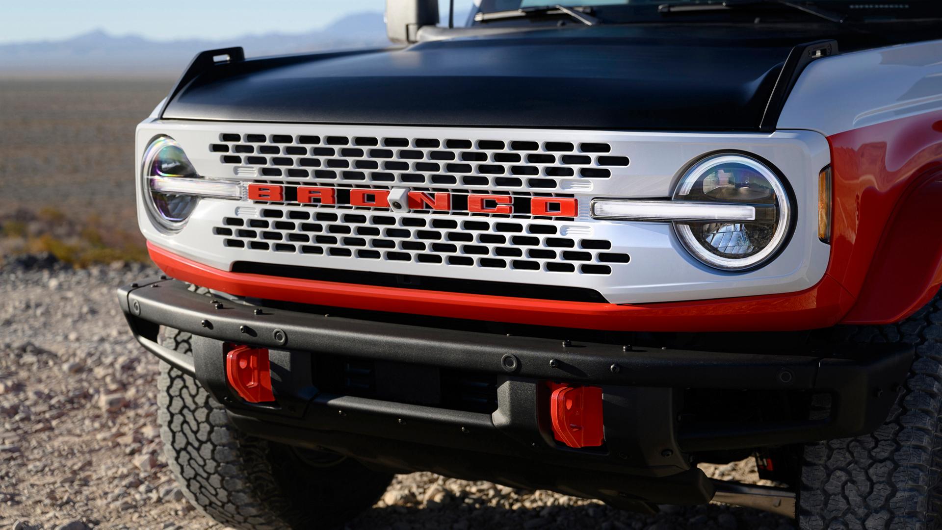 A front view of a 2025 Ford Bronco® Stroppe Edition SUV parked on a rocky landscape