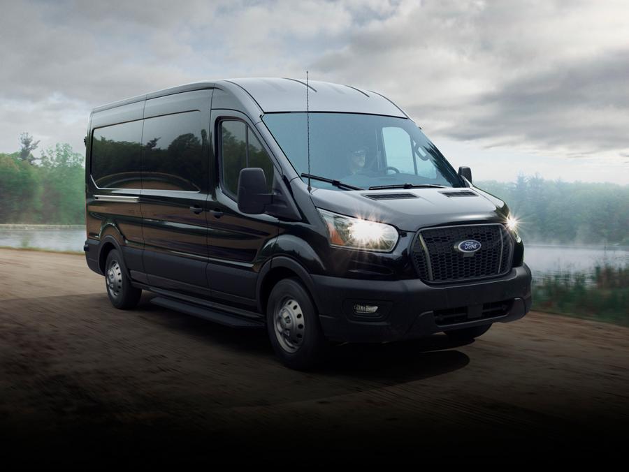 A 2026 Ford Transit® van being driven across a bridge