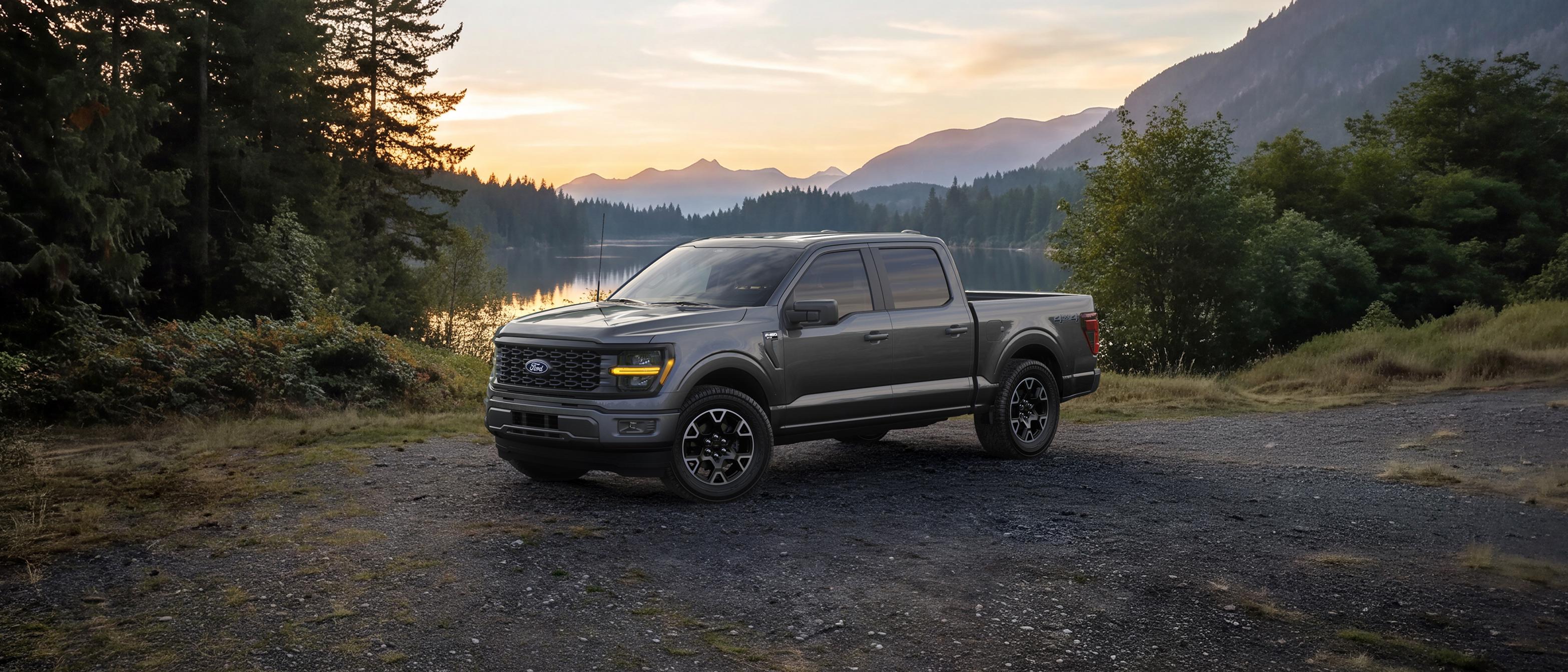 2027 Ford F-150® STX® parked beside a mountain lake