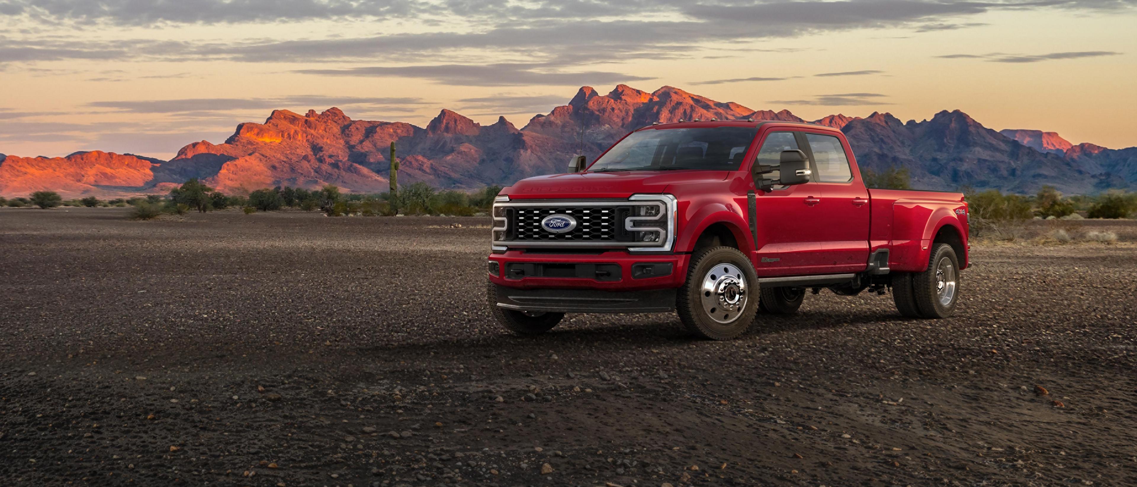 2027 Ford Super Duty F-450 Platinum truck parked on a dirt road in the mountains