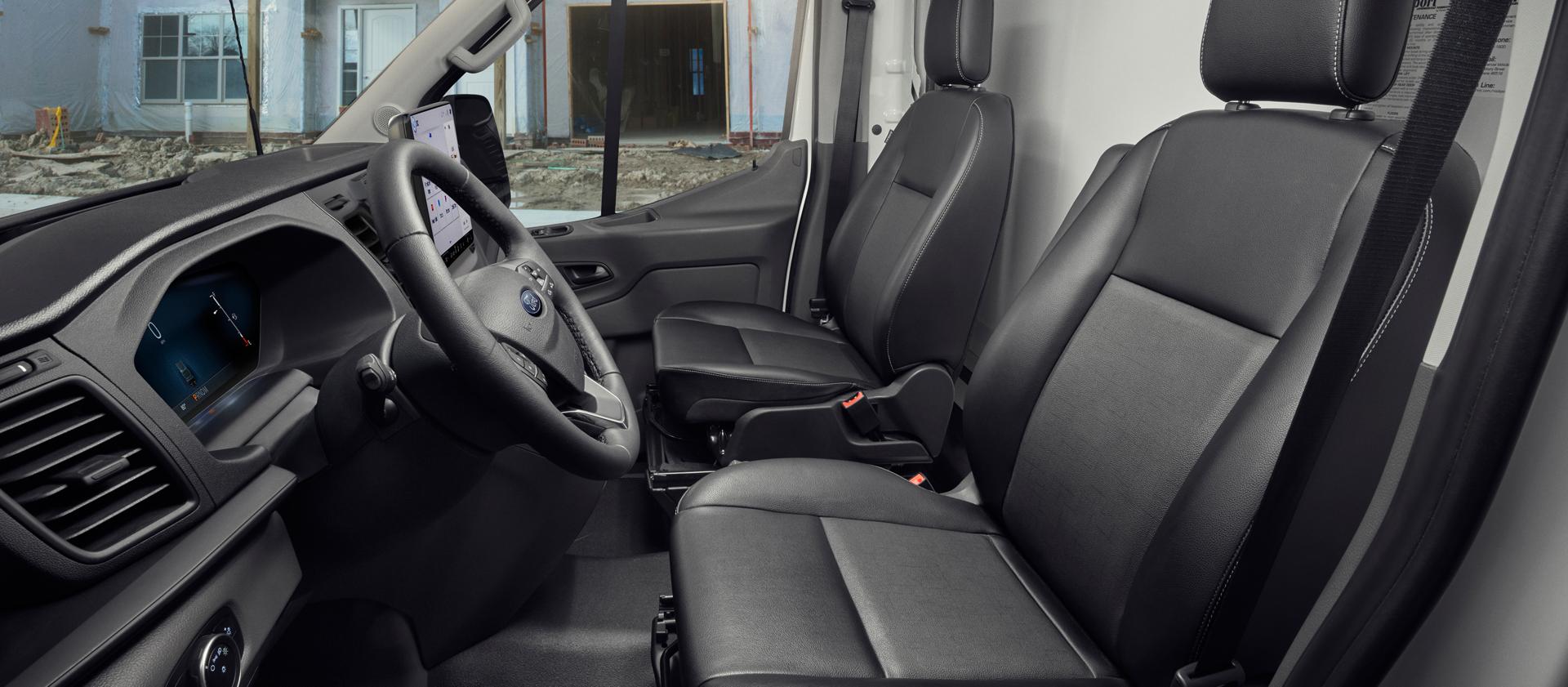 The interior of a 2026 Ford Transit® van driver's and passenger's seat