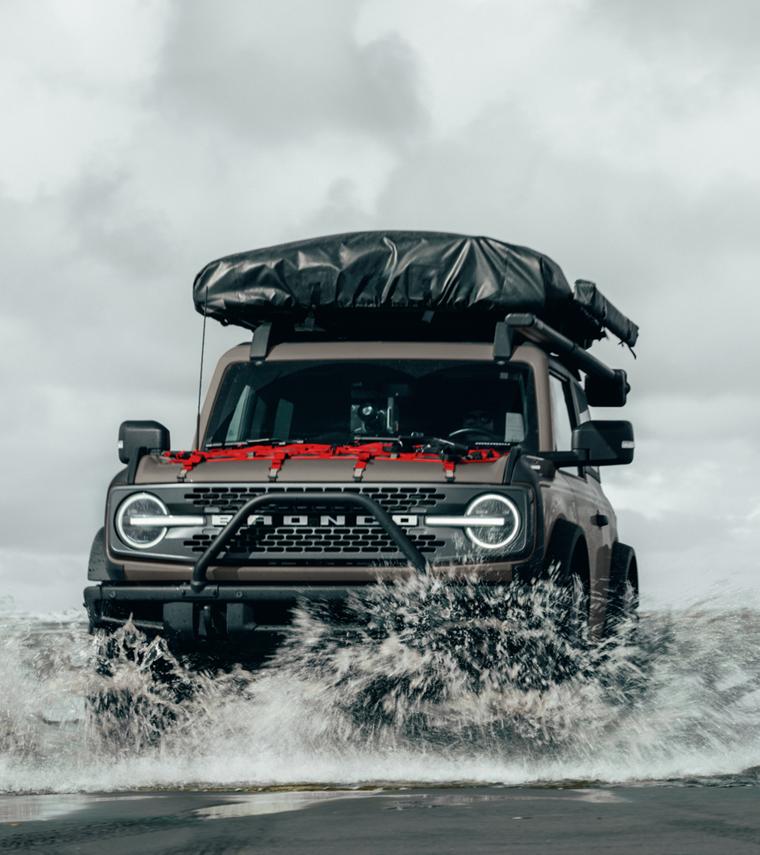 A 2025 Ford Bronco® SUV driving in water