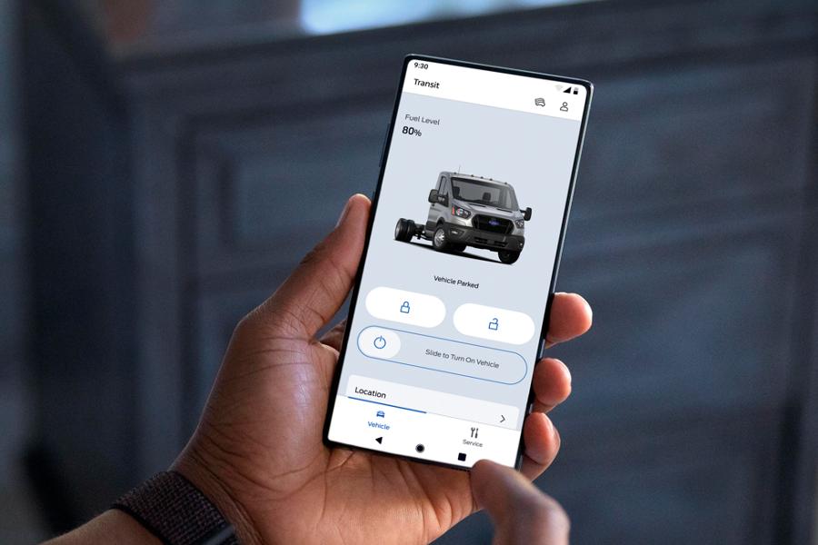 Person holding a smartphone using the available FordPass® App