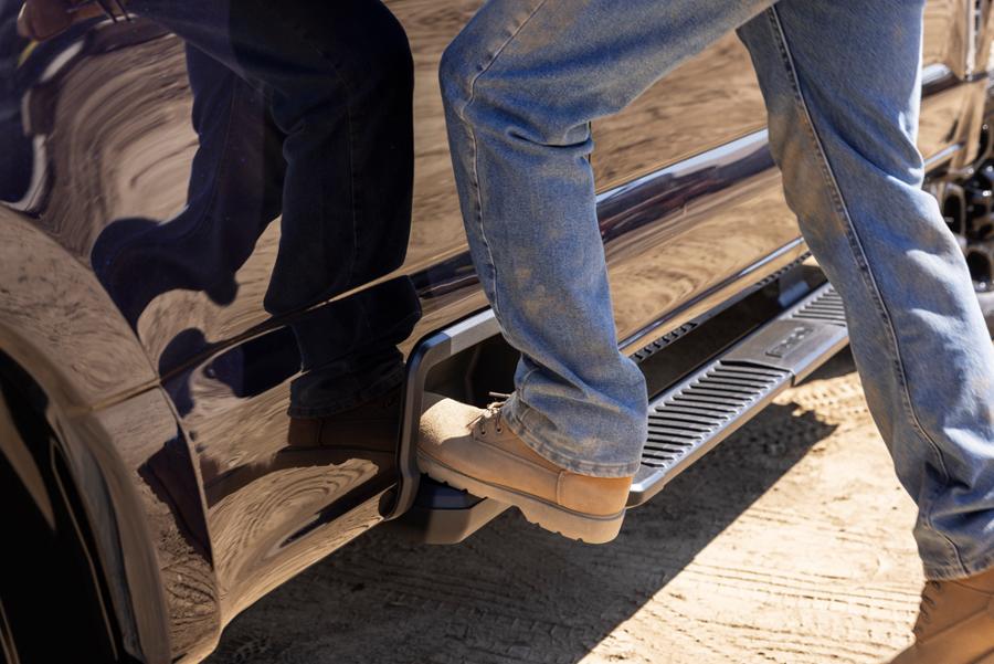 Close-up of a person stepping onto the box side step feature