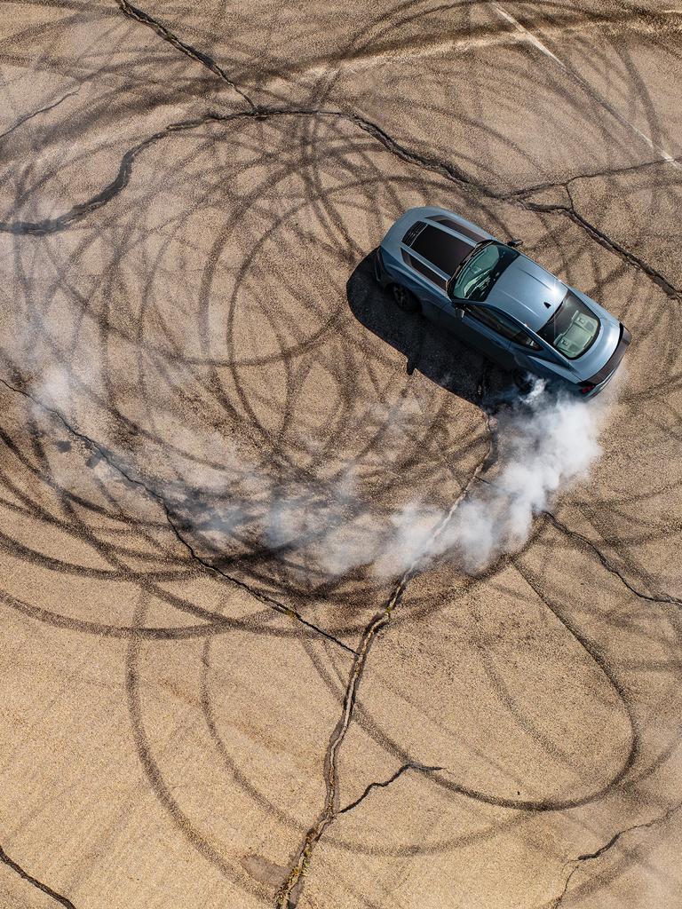 2026 Ford Mustang® Dark Horse® fastback performing burnouts on a closed track