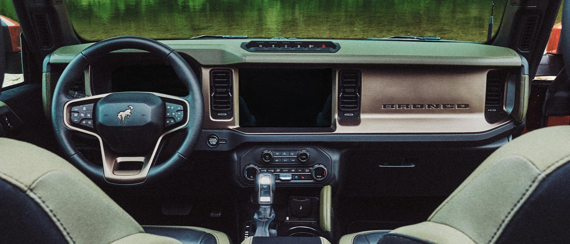 The dashboard and center console inside a 2027 Ford Bronco® Filson™ SUV