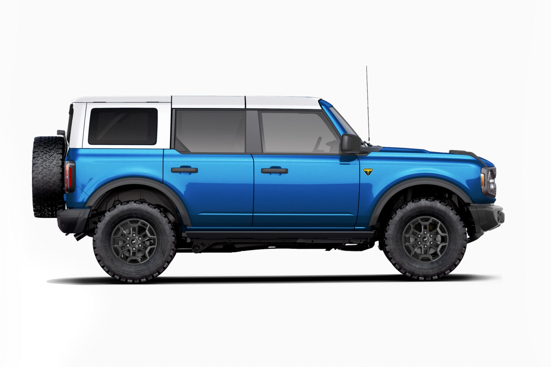 A 2026 Ford Bronco® Badlands in Ruby Red Metallic with a Velocity Blue Metallic-painted roof