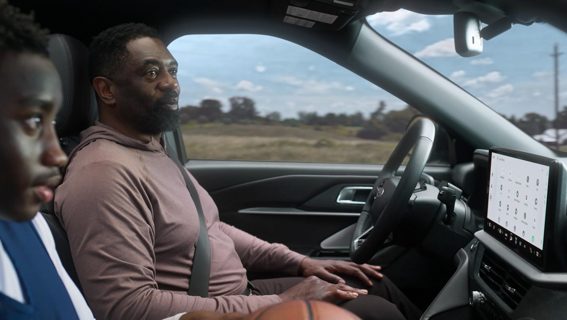 Two men inside a 2026 Ford Explorer® driving