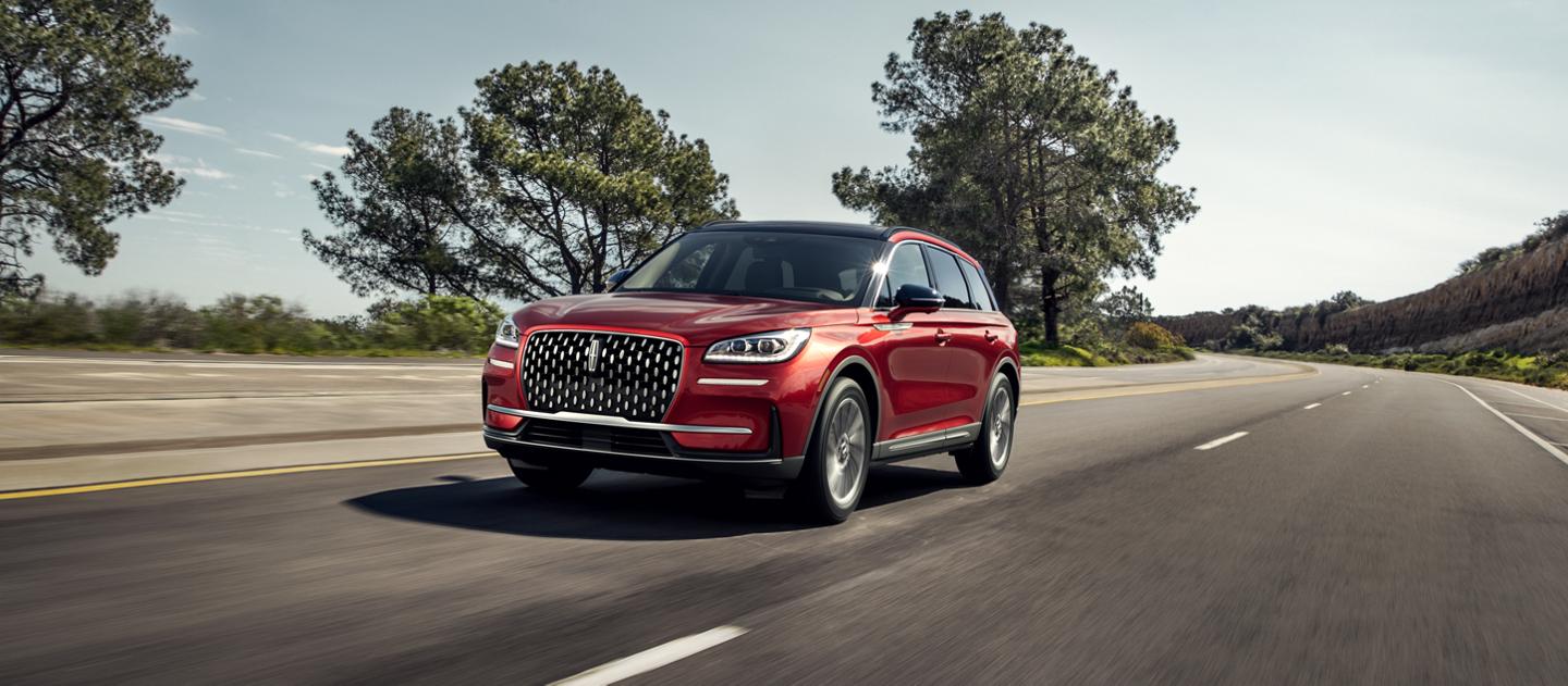 A 2026 Lincoln Corsair® SUV is being driven on a country road