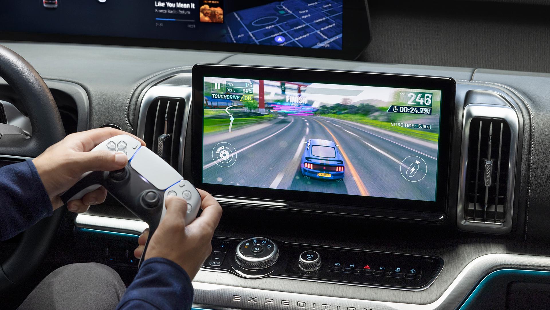 Parked 2027 Ford Expedition® SUV 13.2-inch center display with driver playing a video game