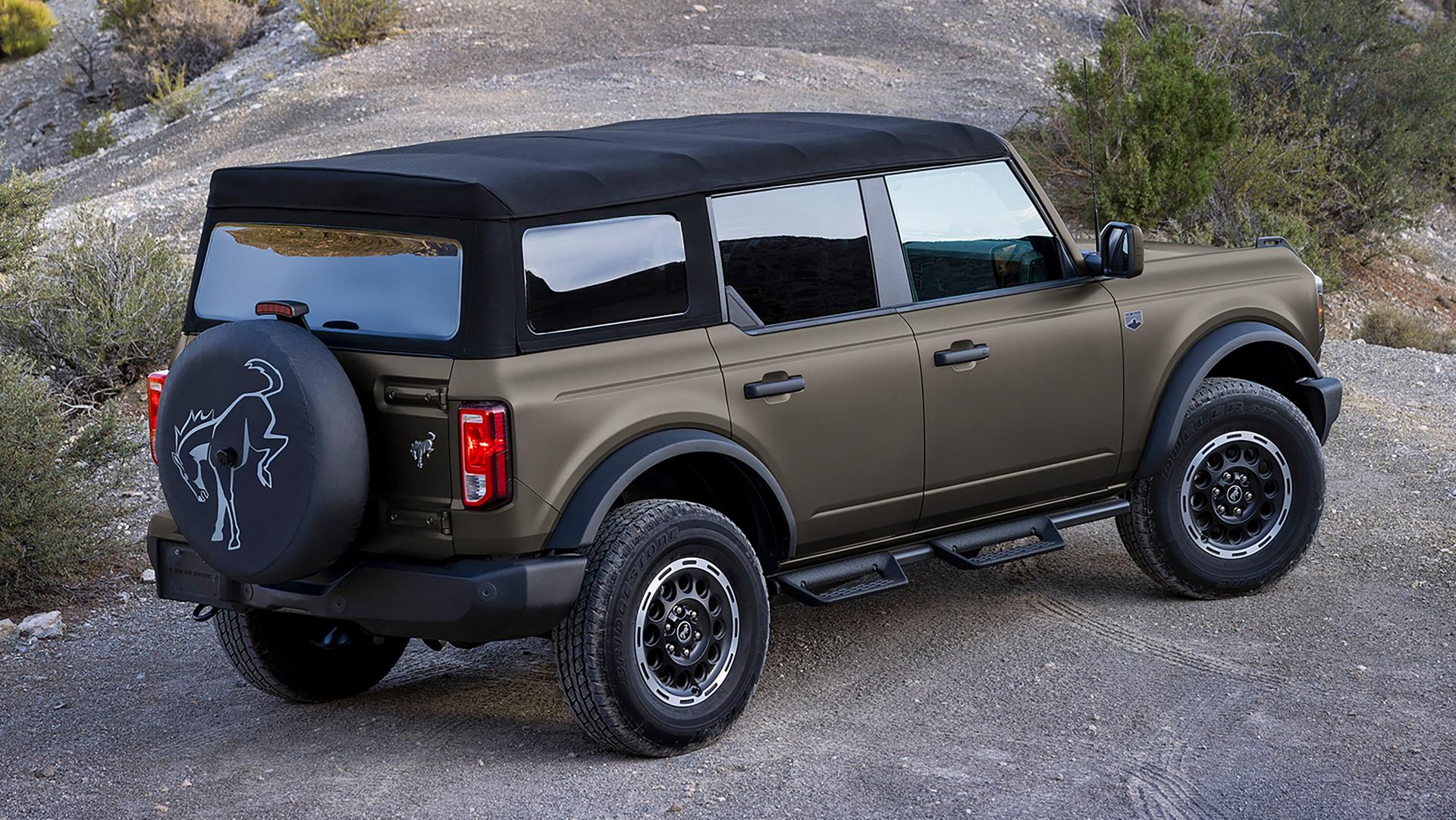 A 2026 Ford Bronco® SUV with available matte film protection, parked on a rock ledge