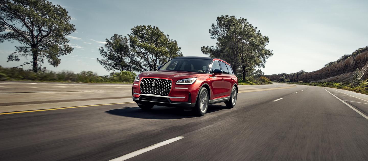 A 2025 Lincoln Corsair Reserve model is being driven on a remote highway