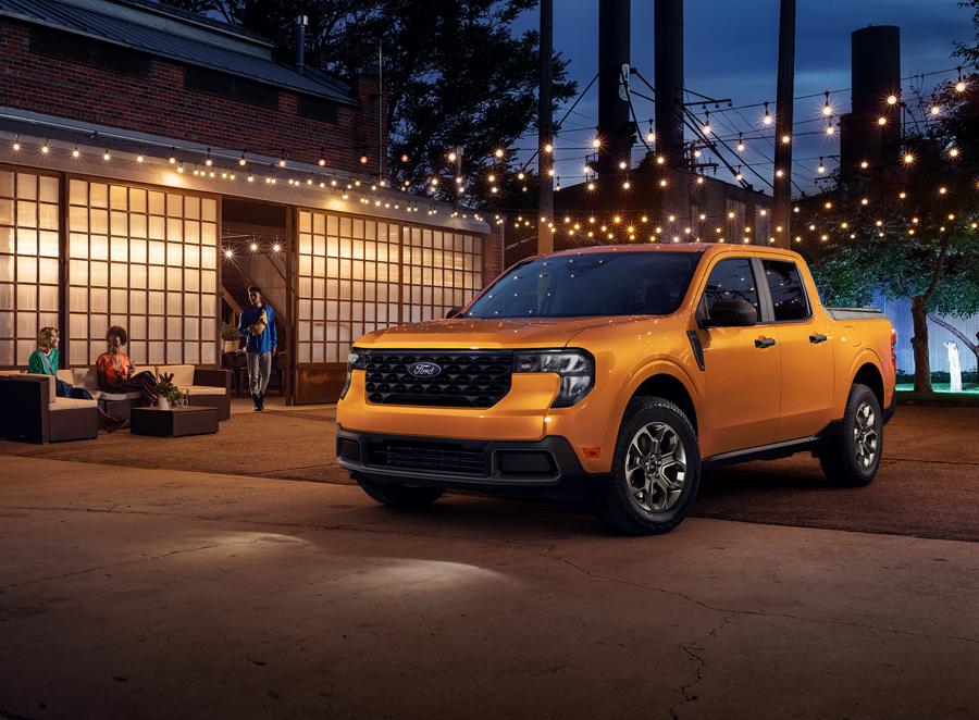 2026 Ford Maverick® pickup parked near a building under lights at night