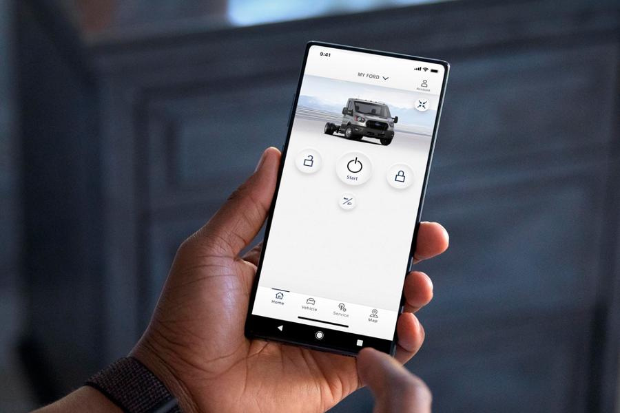 Person holding a smartphone using the available FordPass® App