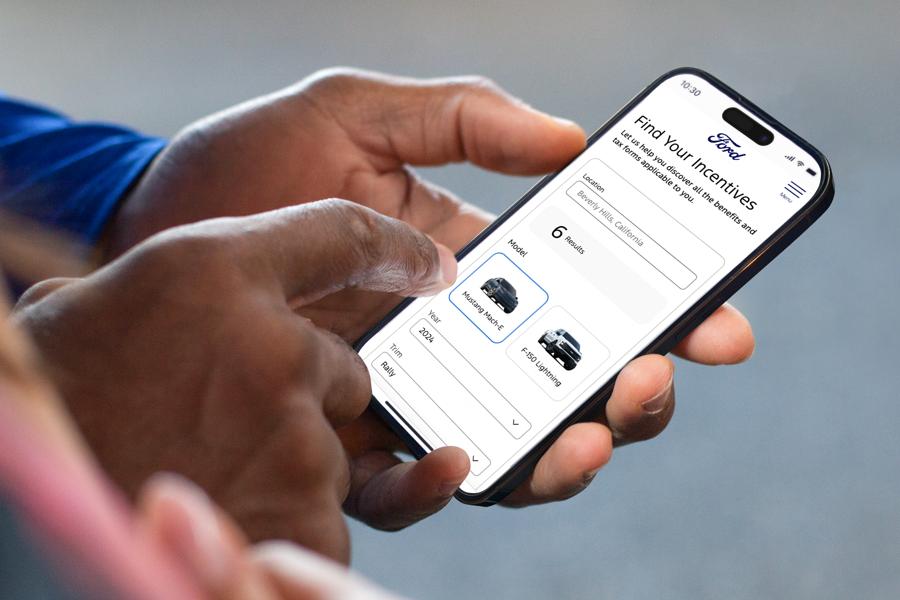 A person on their mobile device searching for local tax incentives