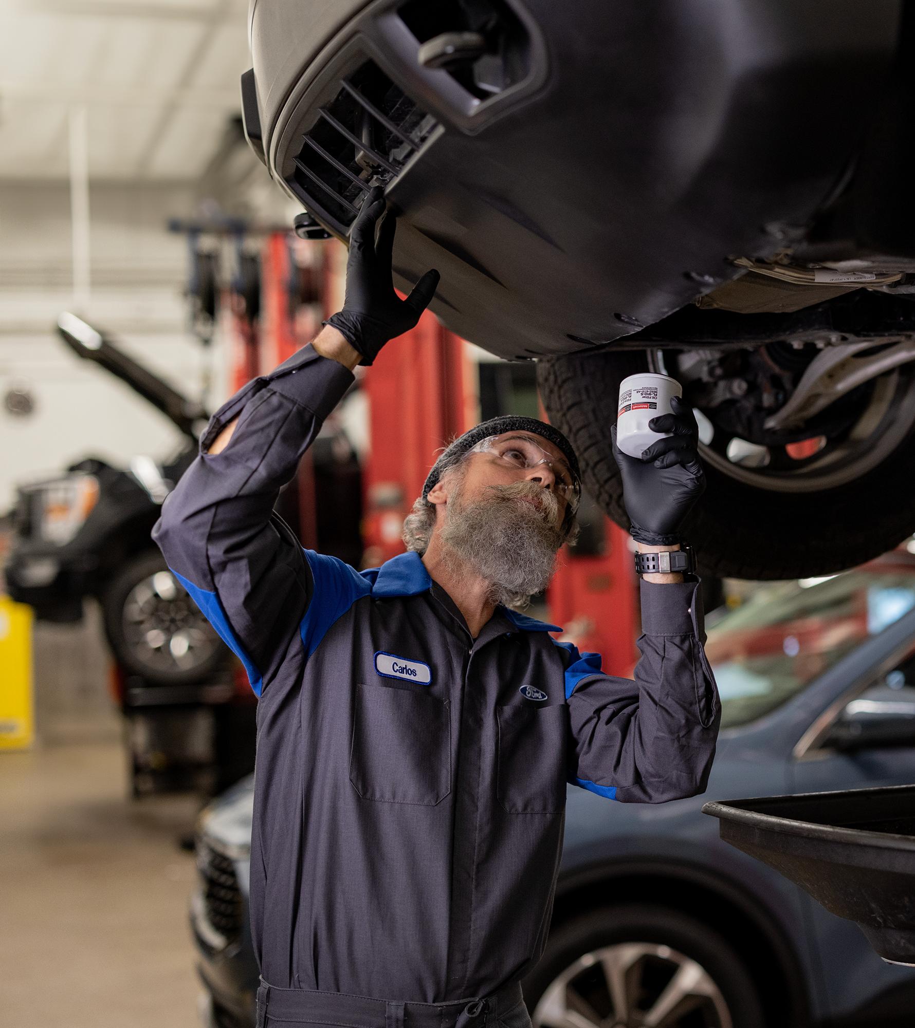 Ford techs service vehicles in the service bay