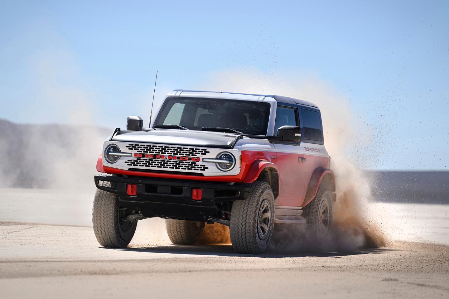 A 2025 Ford Bronco® Stroppe® Edition SUV kicking up sand on a beach