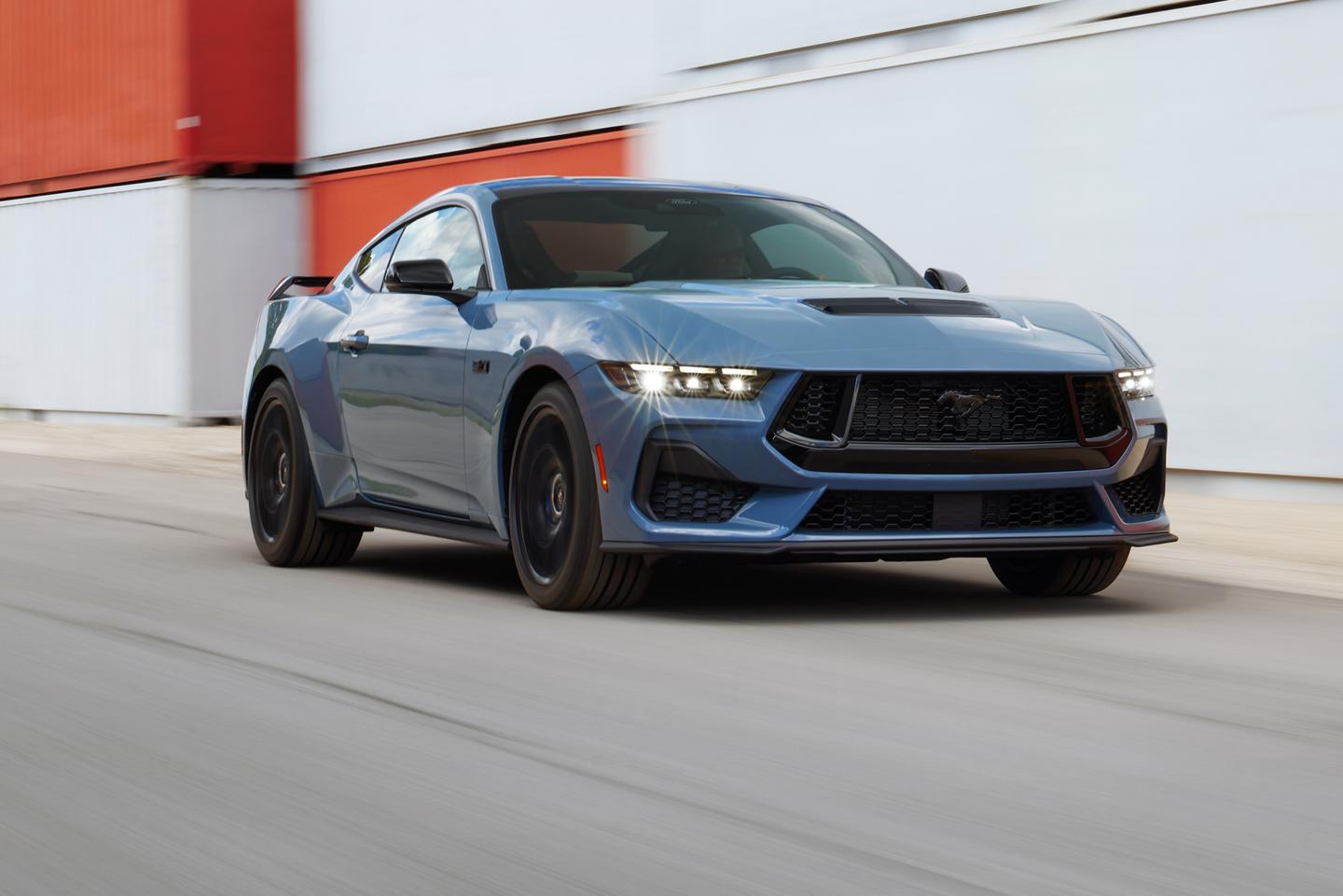 Mustang GT on an urban road.