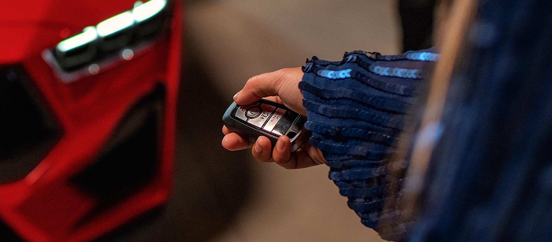 Person using the remote rev feature on a 2026 Ford Mustang® fastback with available automatic transmission