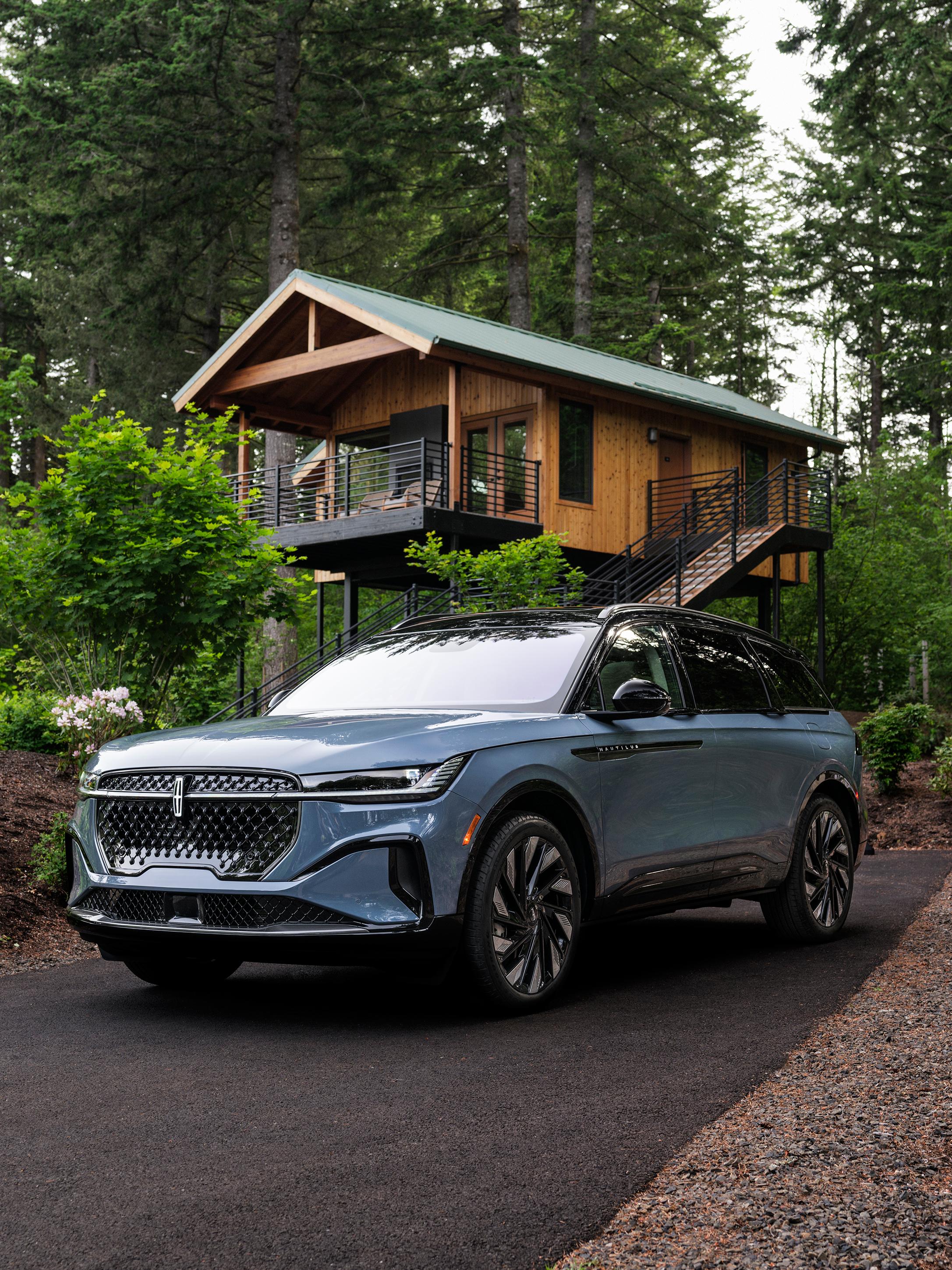 The front of a 2026 Lincoln Nautilus® SUV parked in front of a house