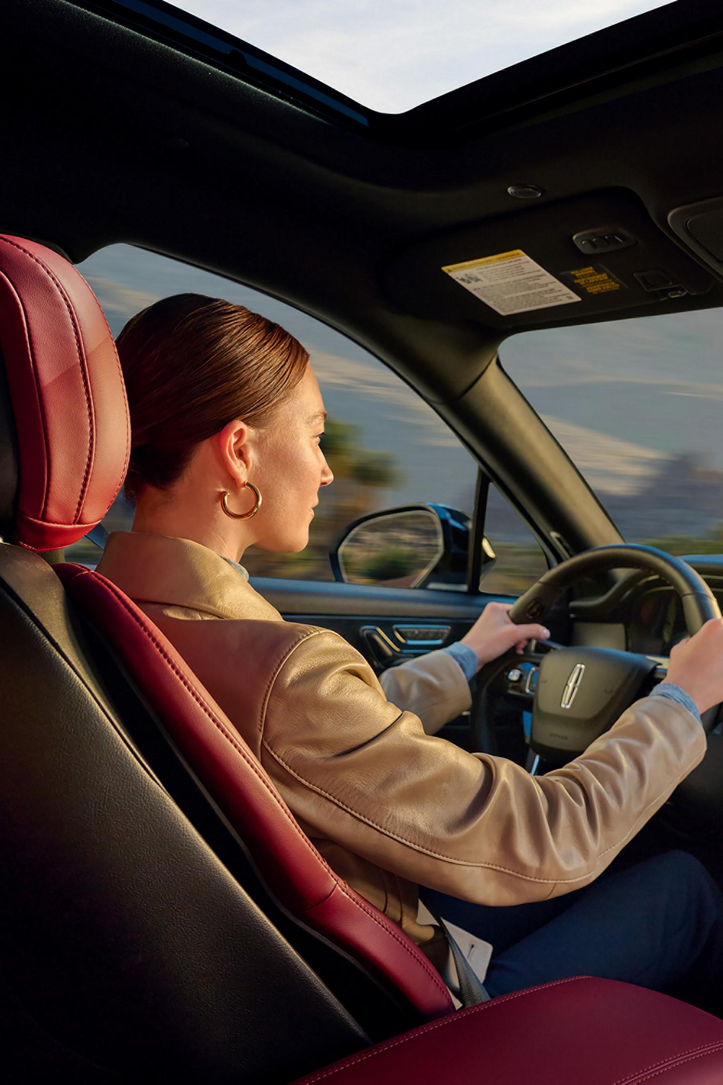 A woman driving inside the 2026 Lincoln Corsair®