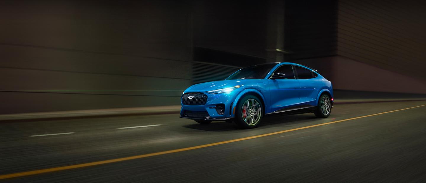2026 Ford Mustang Mach-E® GT model being driven on a city street