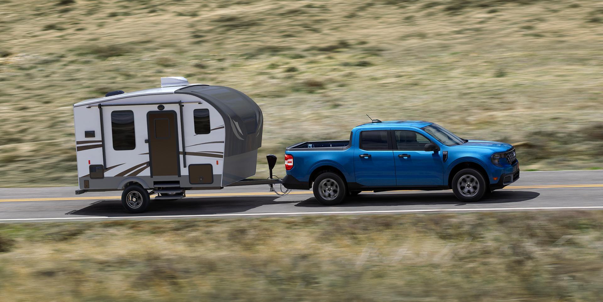 2026 Ford Maverick® pickup pulling a small camper