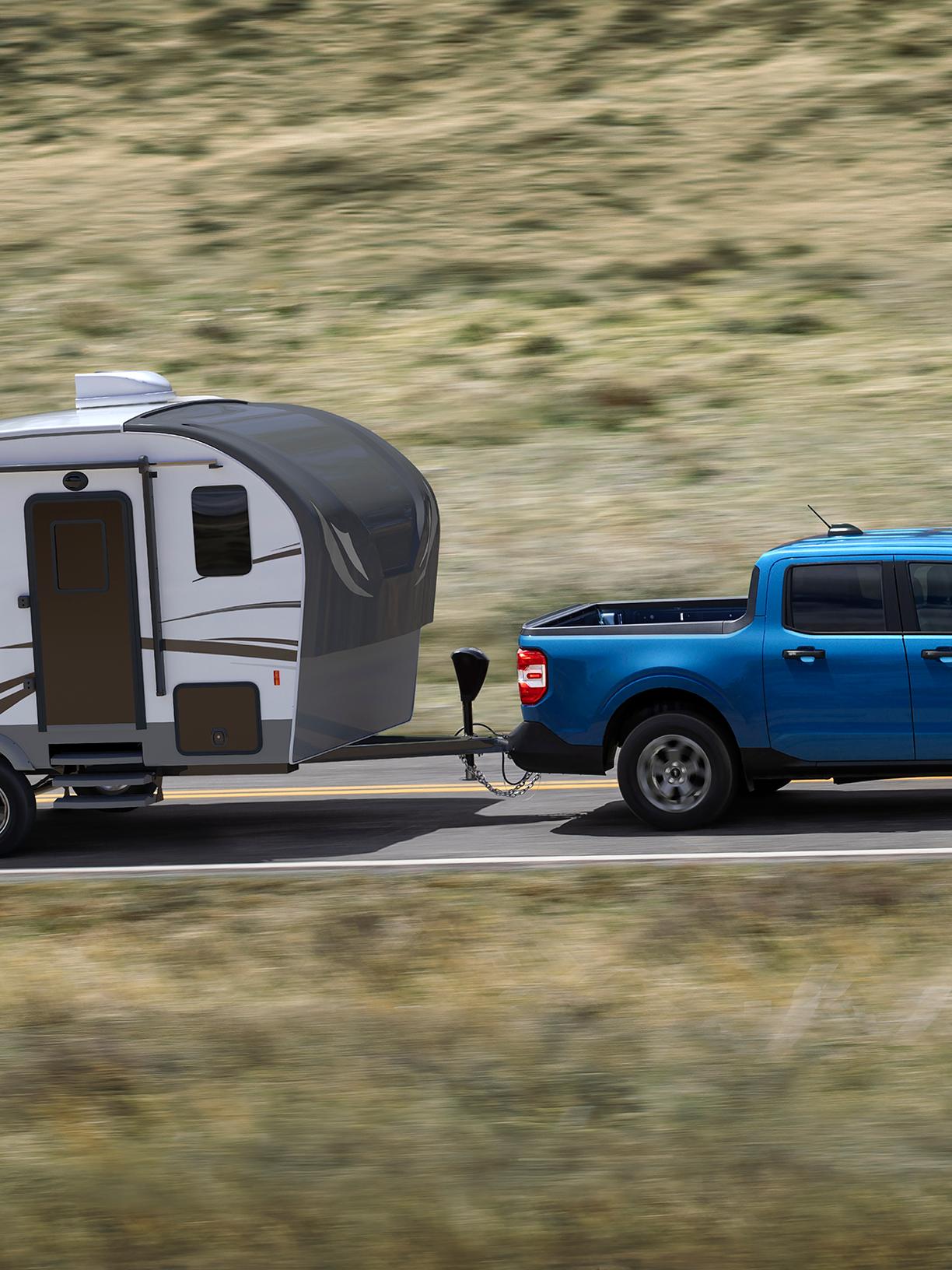 2026 Ford Maverick® pickup pulling a small camper