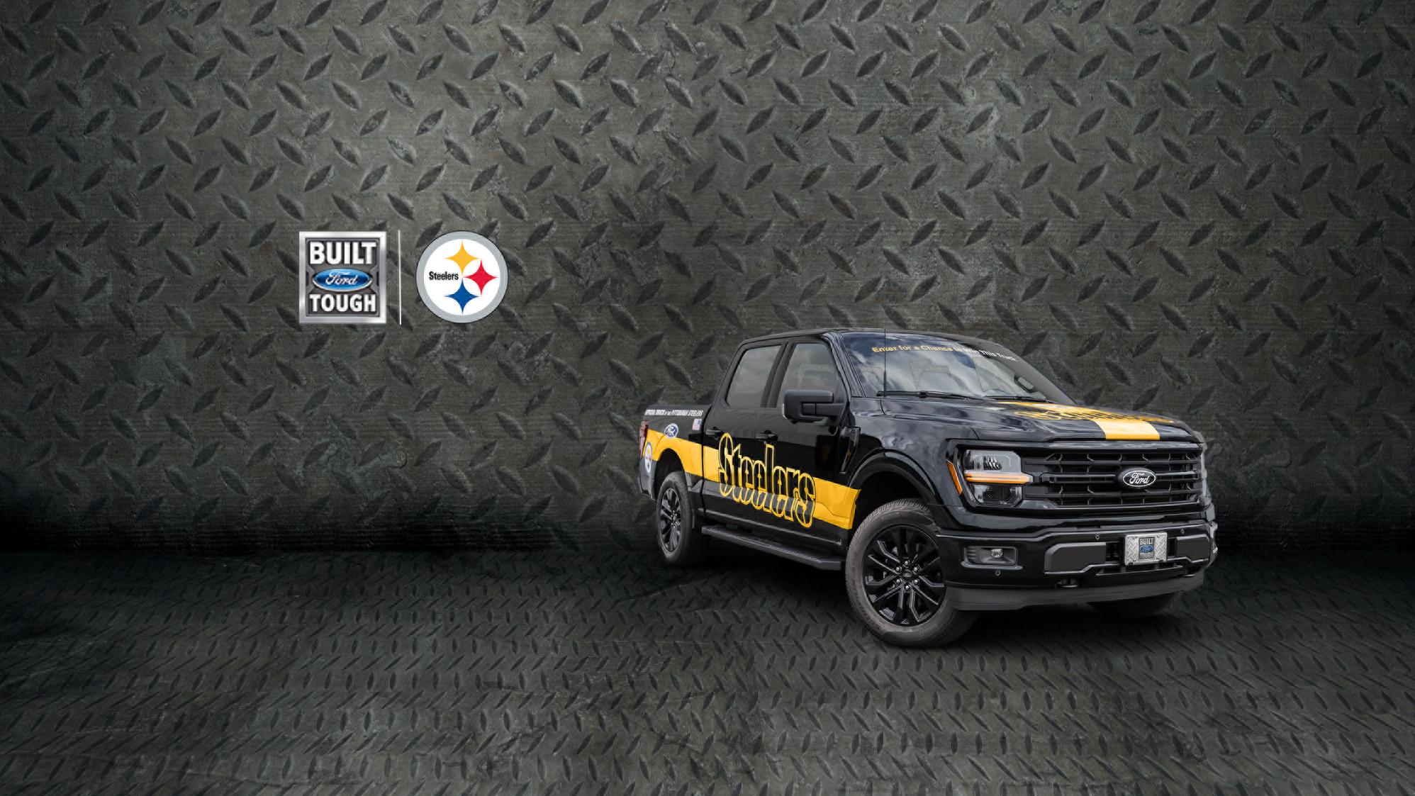 Camioneta Ford F-150 Black con gráficos de los Pittsburgh Steelers en Yellow estacionada sobre una superficie con placa antideslizante.