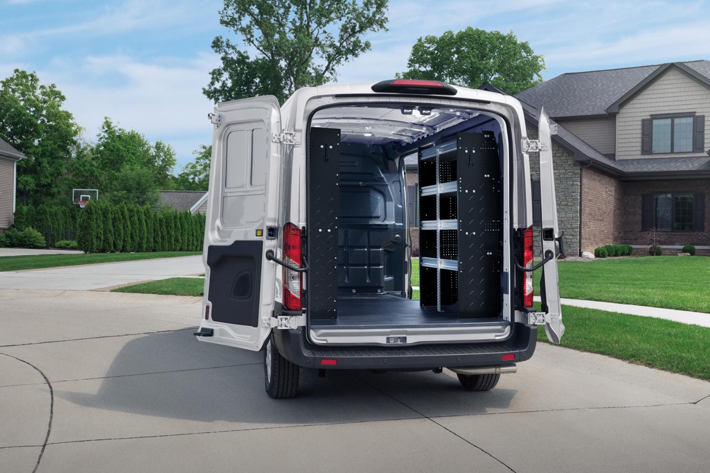 Rear shot of an open 2025 Ford Transit® van showing shelves