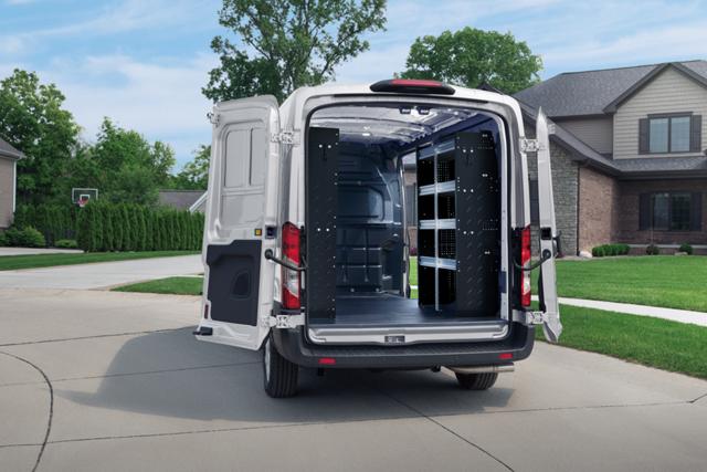 Rear shot of an open 2025 Ford Transit® van showing shelves