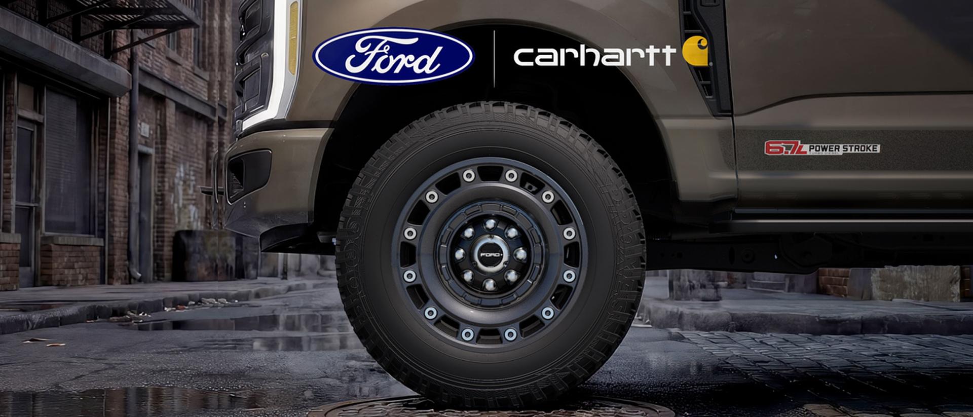 Close-up of a special edition wheel on the 2027 Ford Super Duty® truck parked over a manhole cover in Detroit