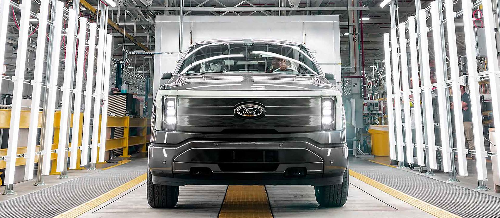 A rouge electric vehicle on the production line