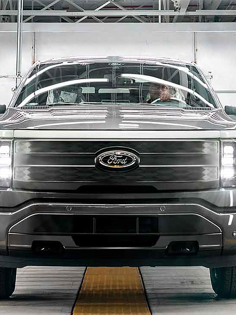 A rouge electric vehicle on the production line