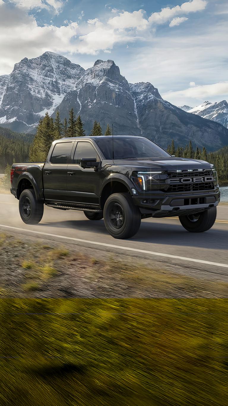 A 2026 Ford F-150® Raptor® driving on a mountain road