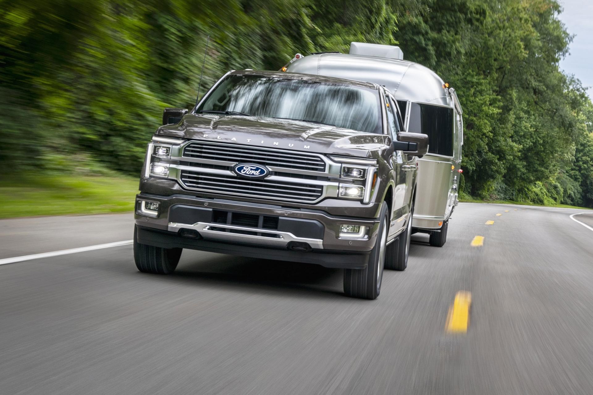 Grey 2026 Ford F-150® truck towing a trailer