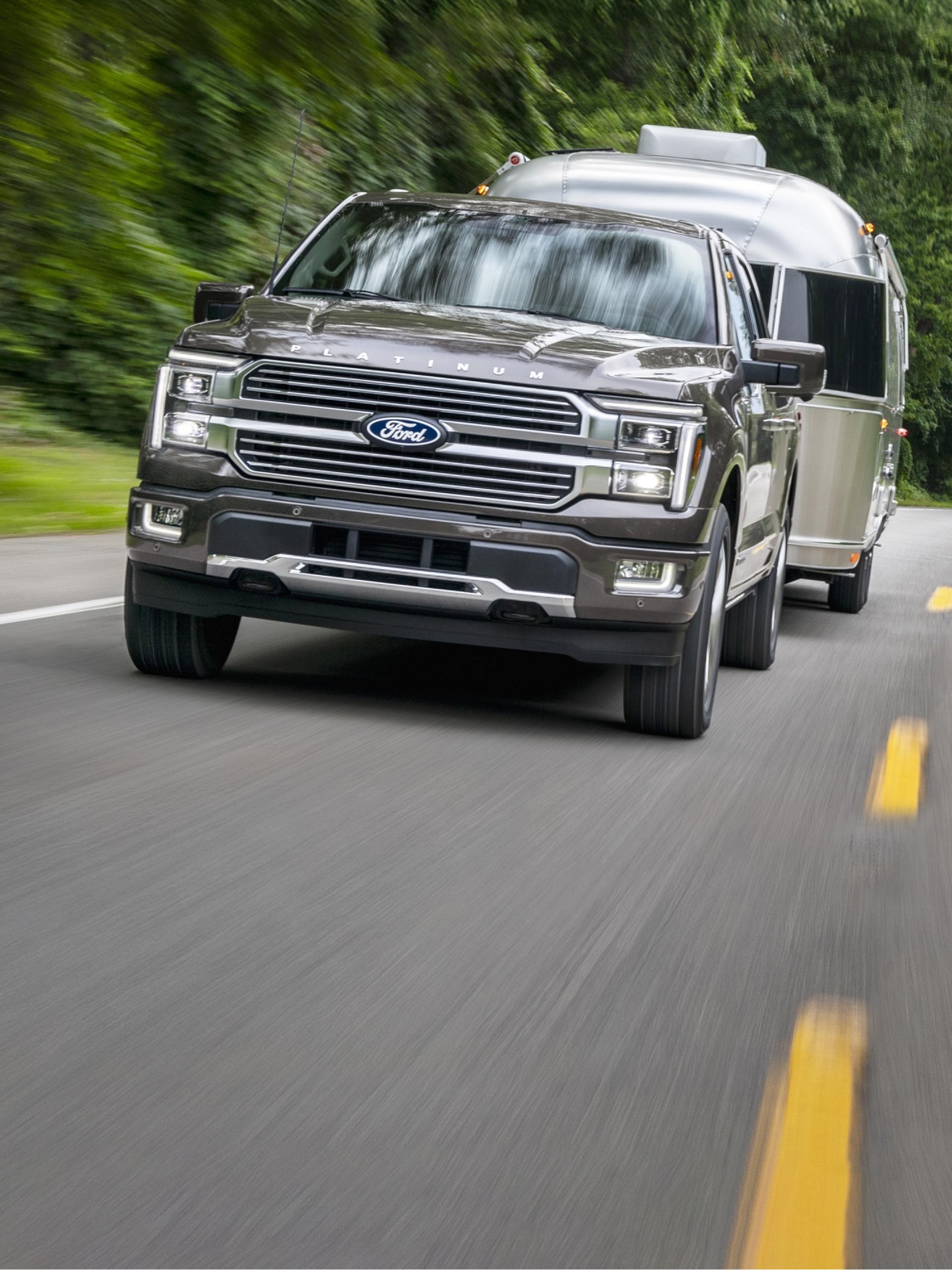Grey 2026 Ford F-150® truck towing a trailer